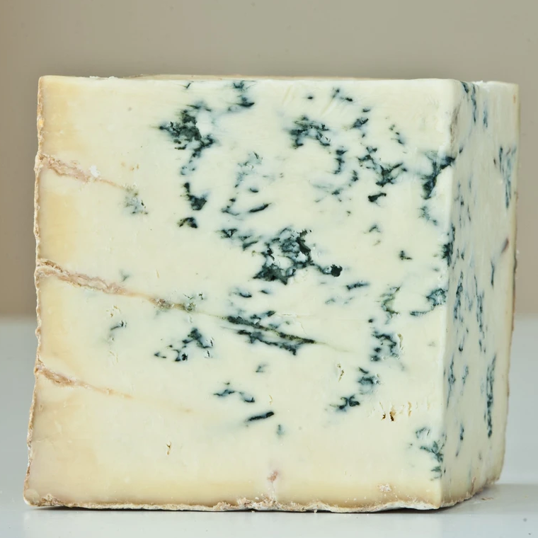 wedge of pale yellow blue cheese