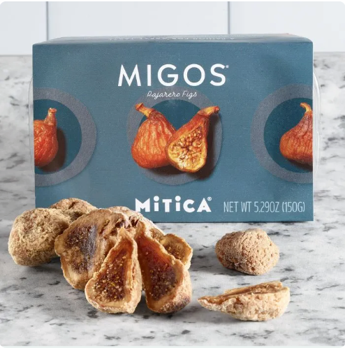 Box of MIGOS Mitica figs on a marble surface