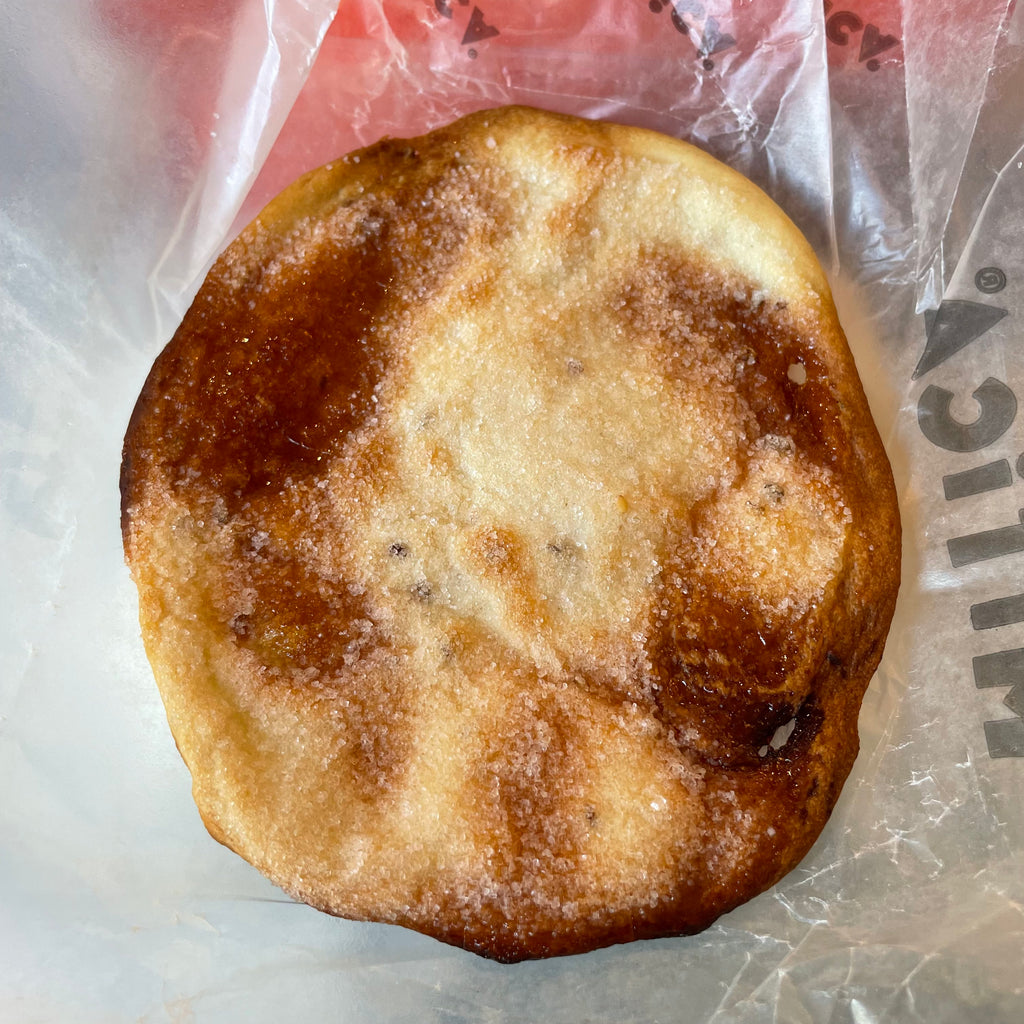 Sweetened olive oil flatbread, aerial view, on wax paper