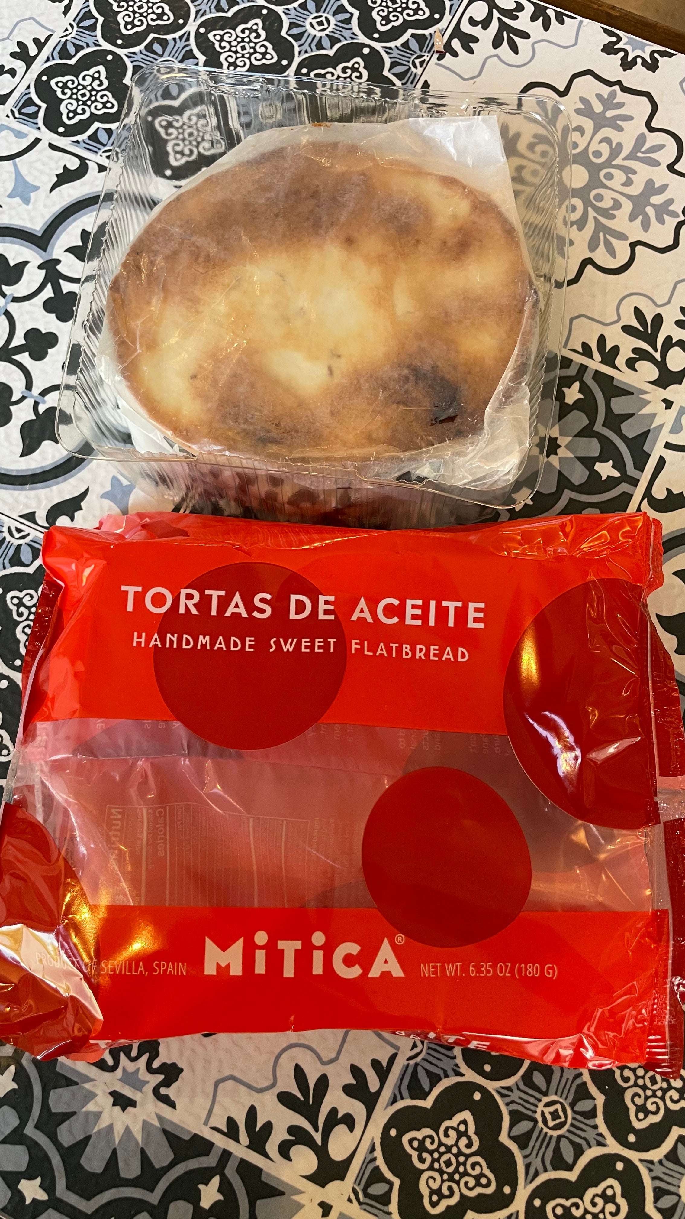 Packaged tortas de aceite with Mitica branding on a patterned surface