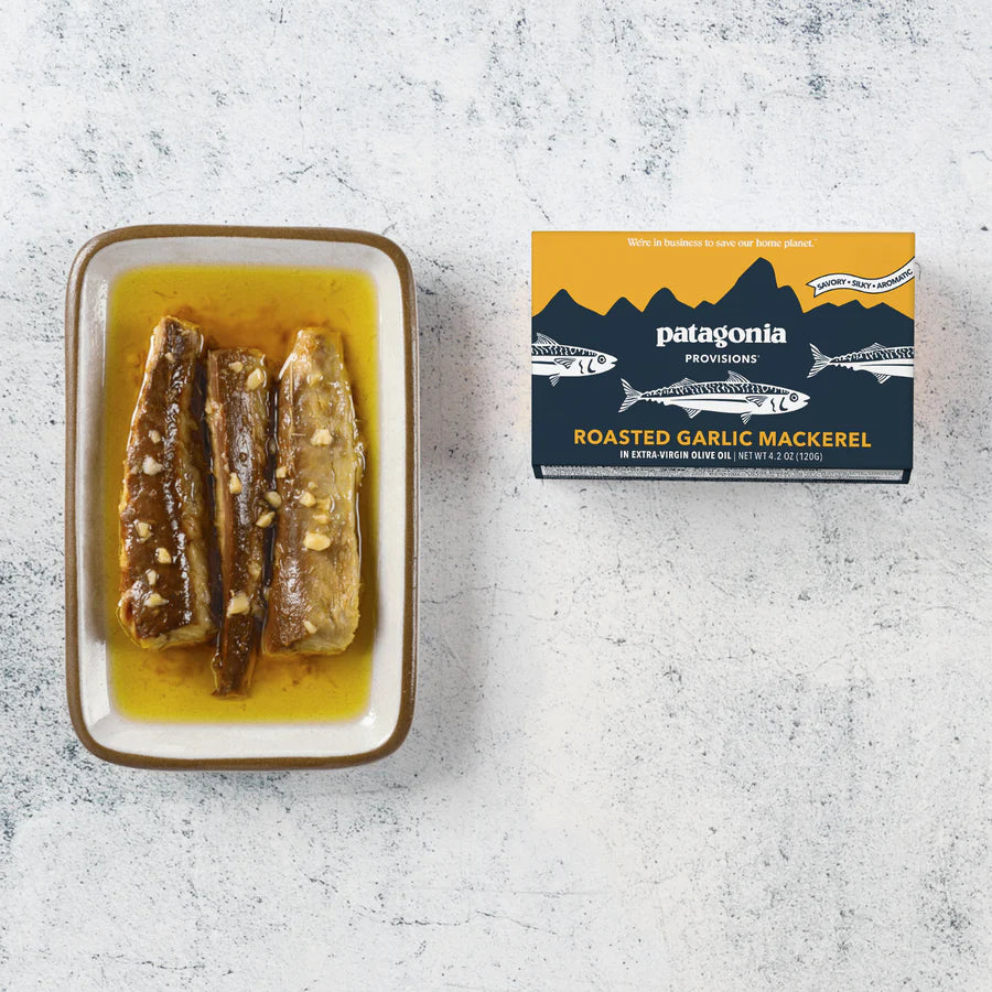 Patagonia Provisions roasted garlic mackerel packaging with mackerel on a plate on a textured surface