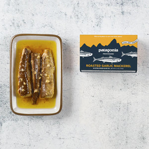 Patagonia Provisions roasted garlic mackerel packaging with mackerel on a plate on a textured surface