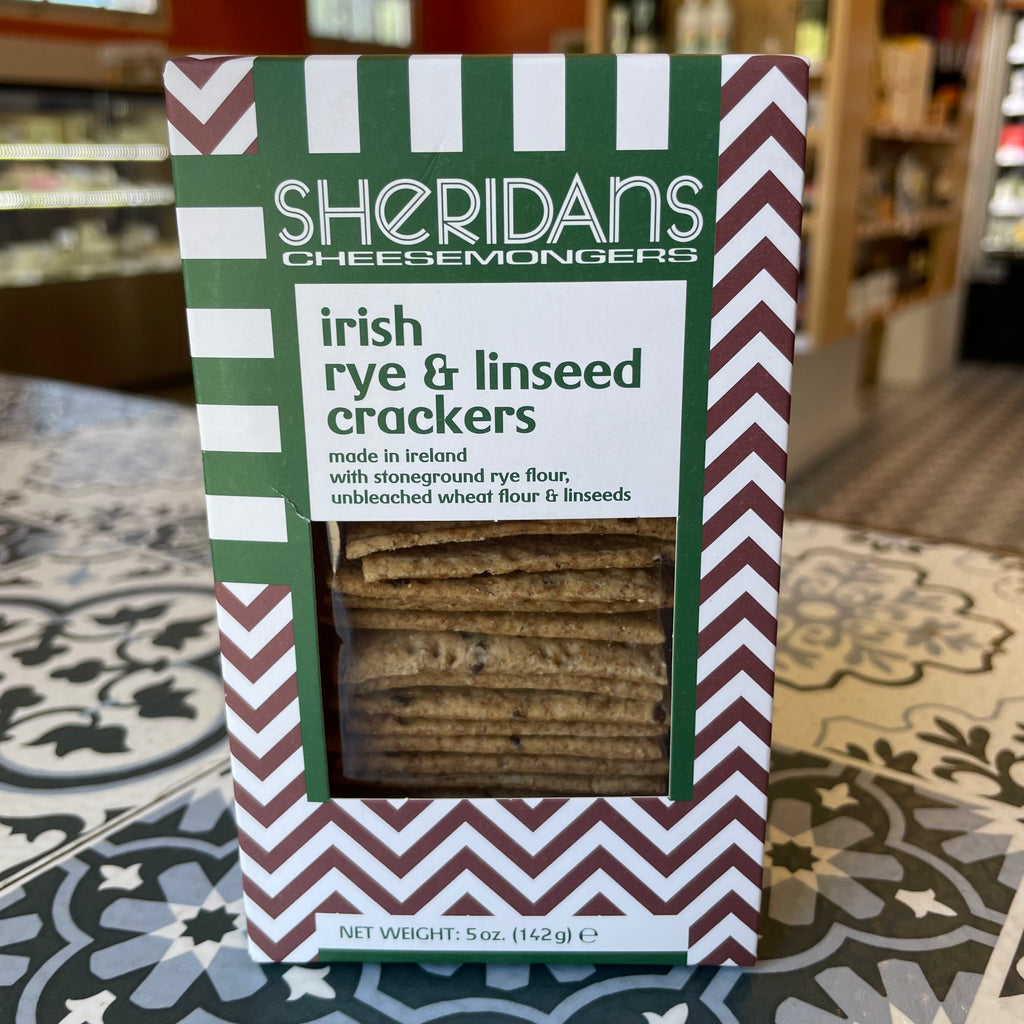 Box of Sheridans Irish rye & linseed crackers on a patterned surface