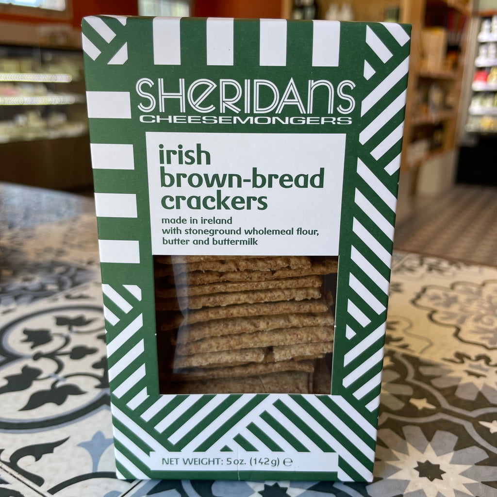Pack of Irish brown bread crackers with Sheridan's Cheesemongers branding on a patterned surface.