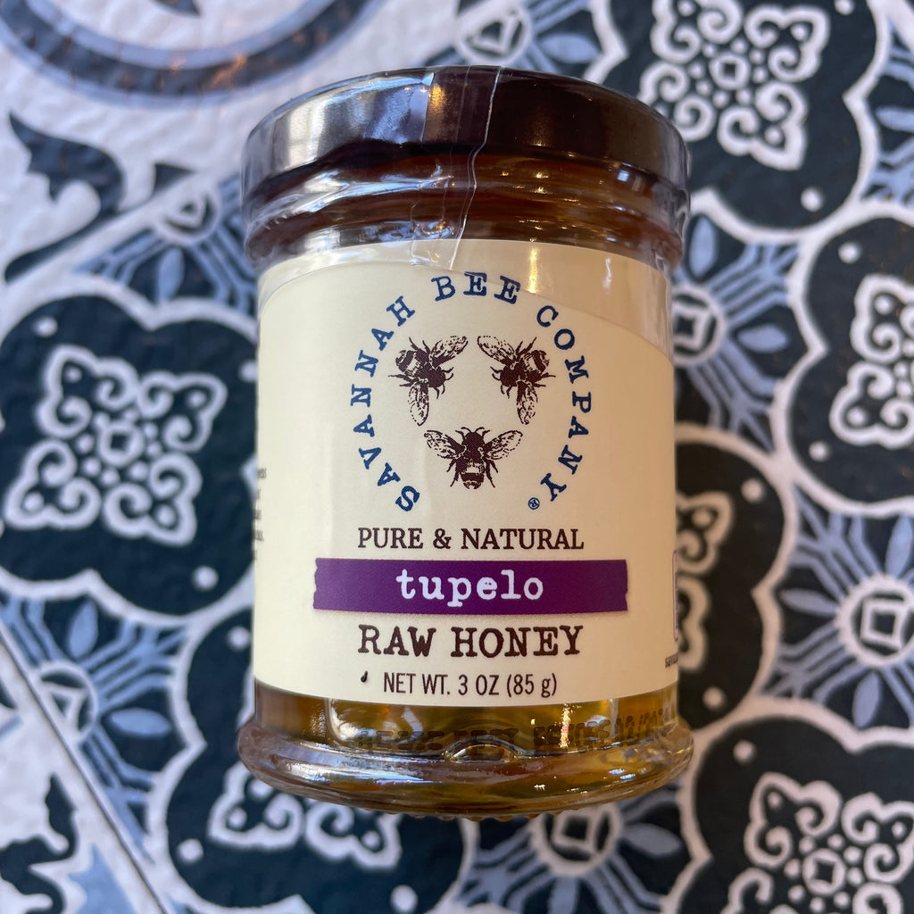 Tupelo honey - Front side showing savannah Bee Company Logo 'Raw Honey" on flower tile design
