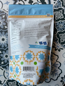 Back side of villa jerada za'atar, patterned bag, with nutrition facts and small blurb about business, on a patterned surface
