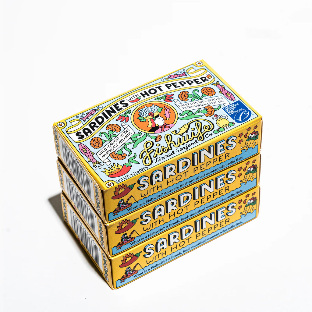 Stack of sardine with hot pepper boxes on a white background