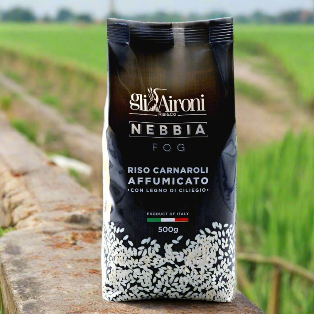 black bag of smoked rice, in rice fields