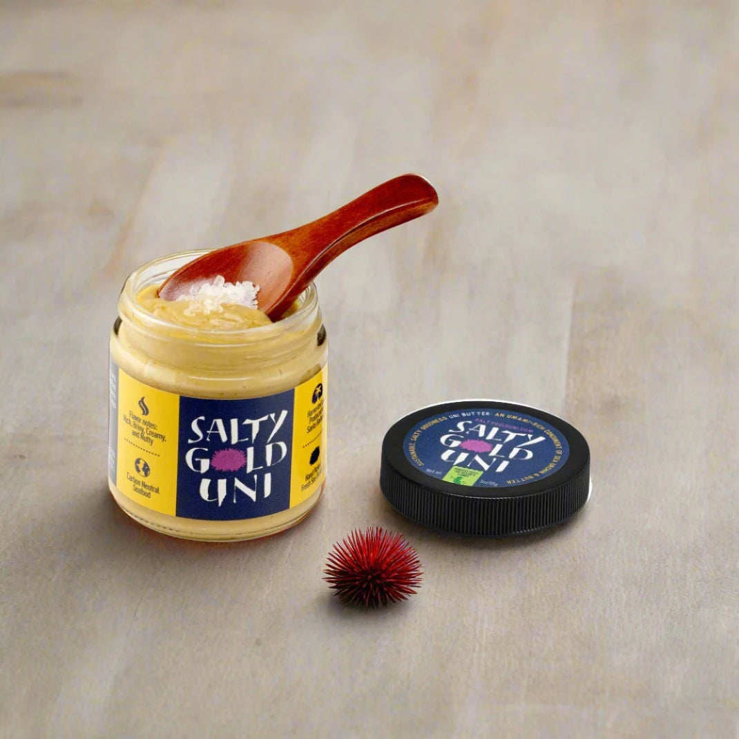 small glass jar of yellow/brown butter, with sea urchin