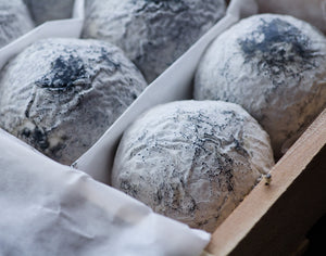 a case of 6 wabash cannonballs, round cheese, with less of a wrinkley texture than most, with a white and dark grey rind