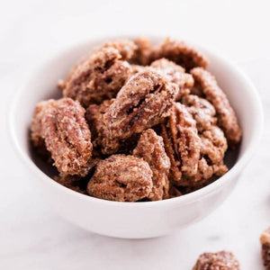 White bowl of candied pecans