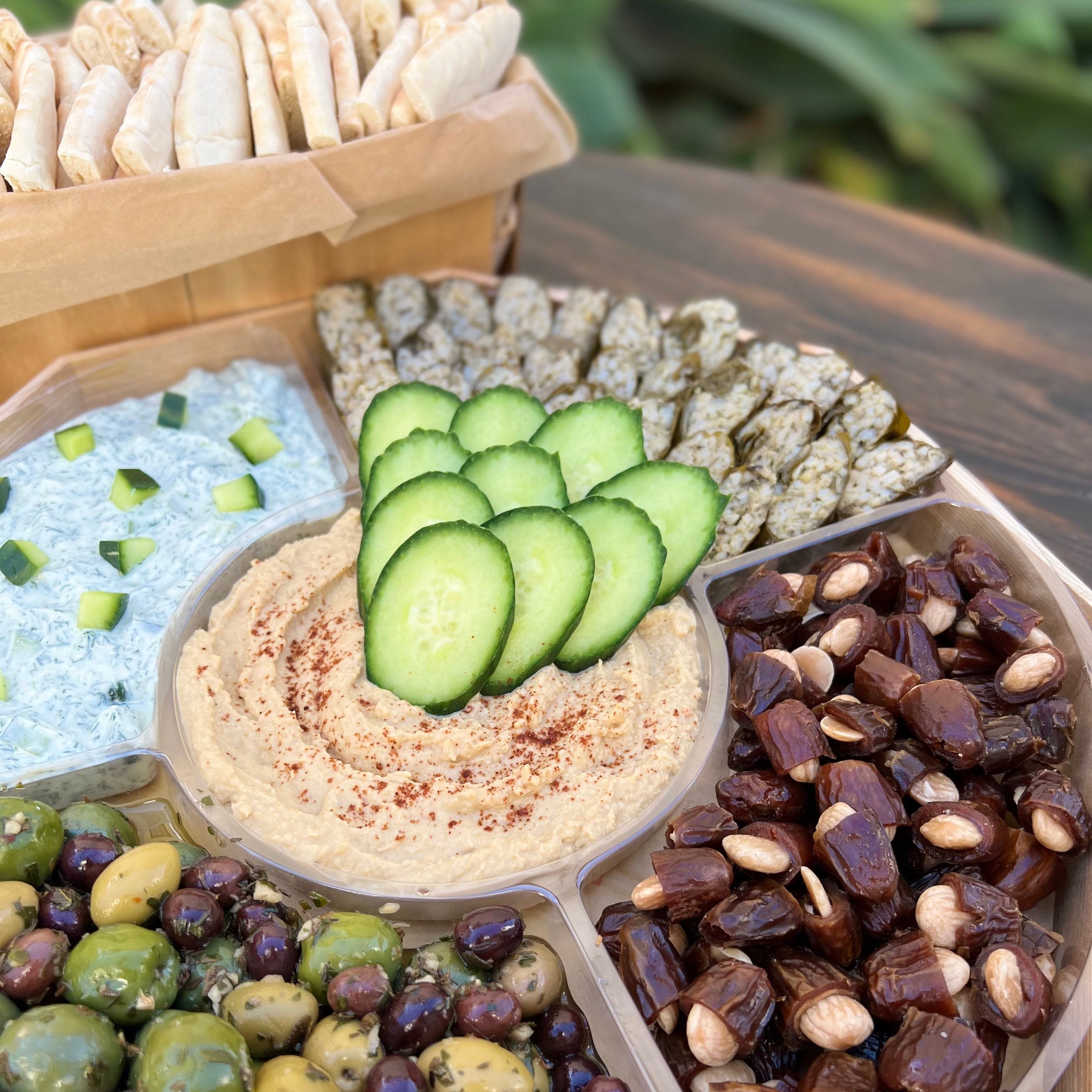 5 sectioned mediterranean platter with pita bread