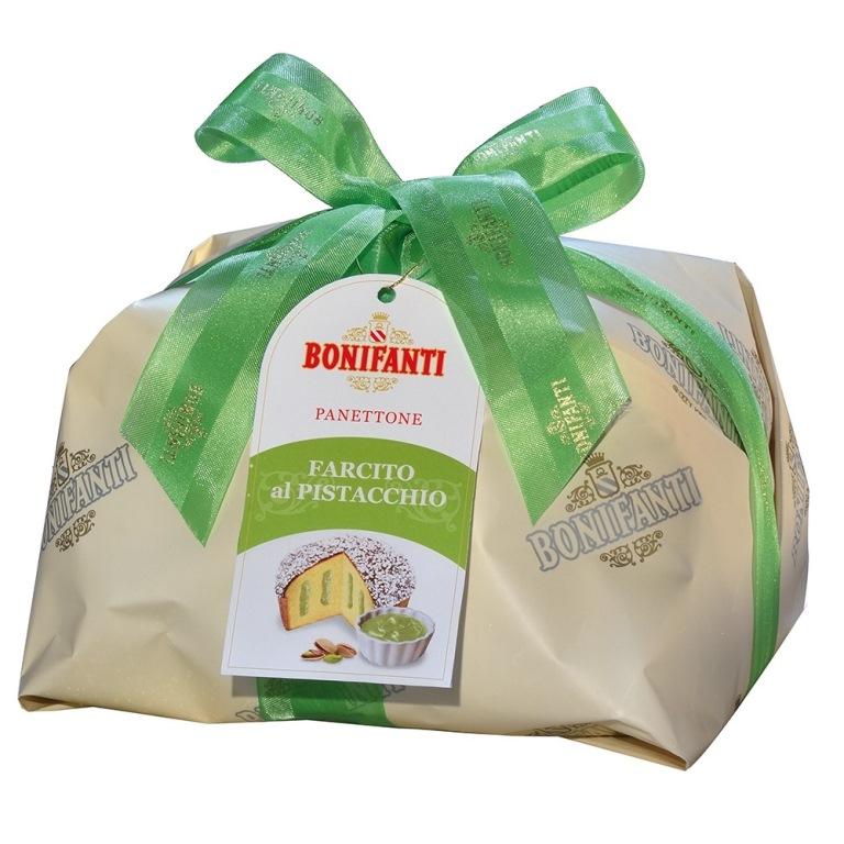 This fluffy cake is filled with a soft pistachio cream flavored with almonds and orange blossom and covered with cocoa glaze and decorated with white chocolate flakes.