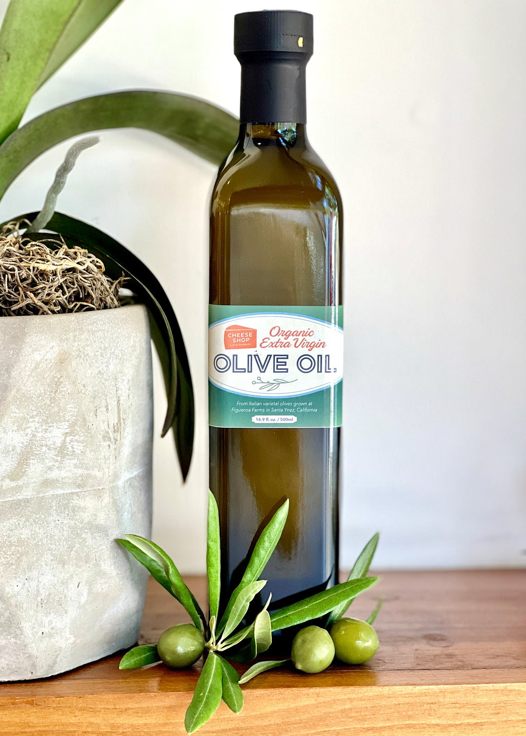 green square prism bottle of olive oil