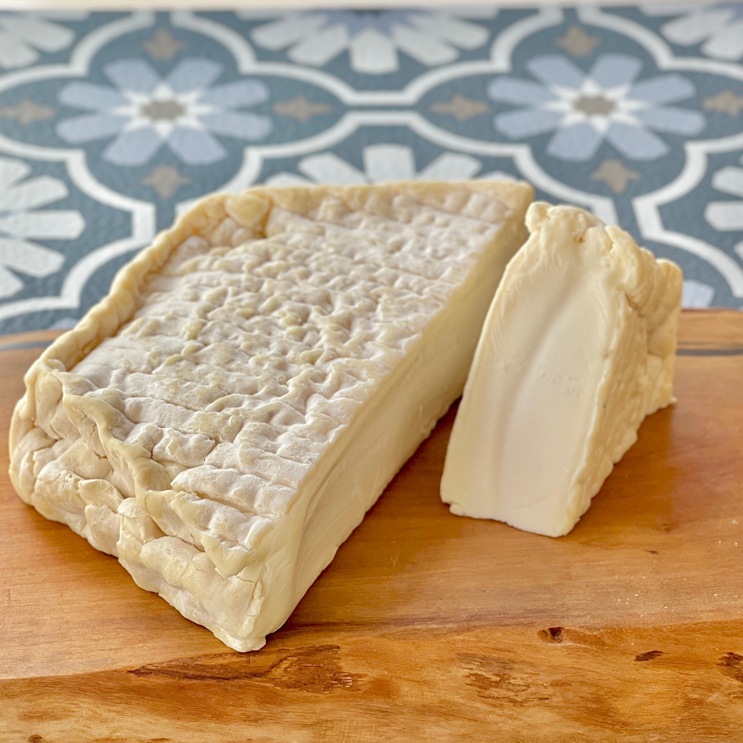 wedge and half wheel of florette cheese