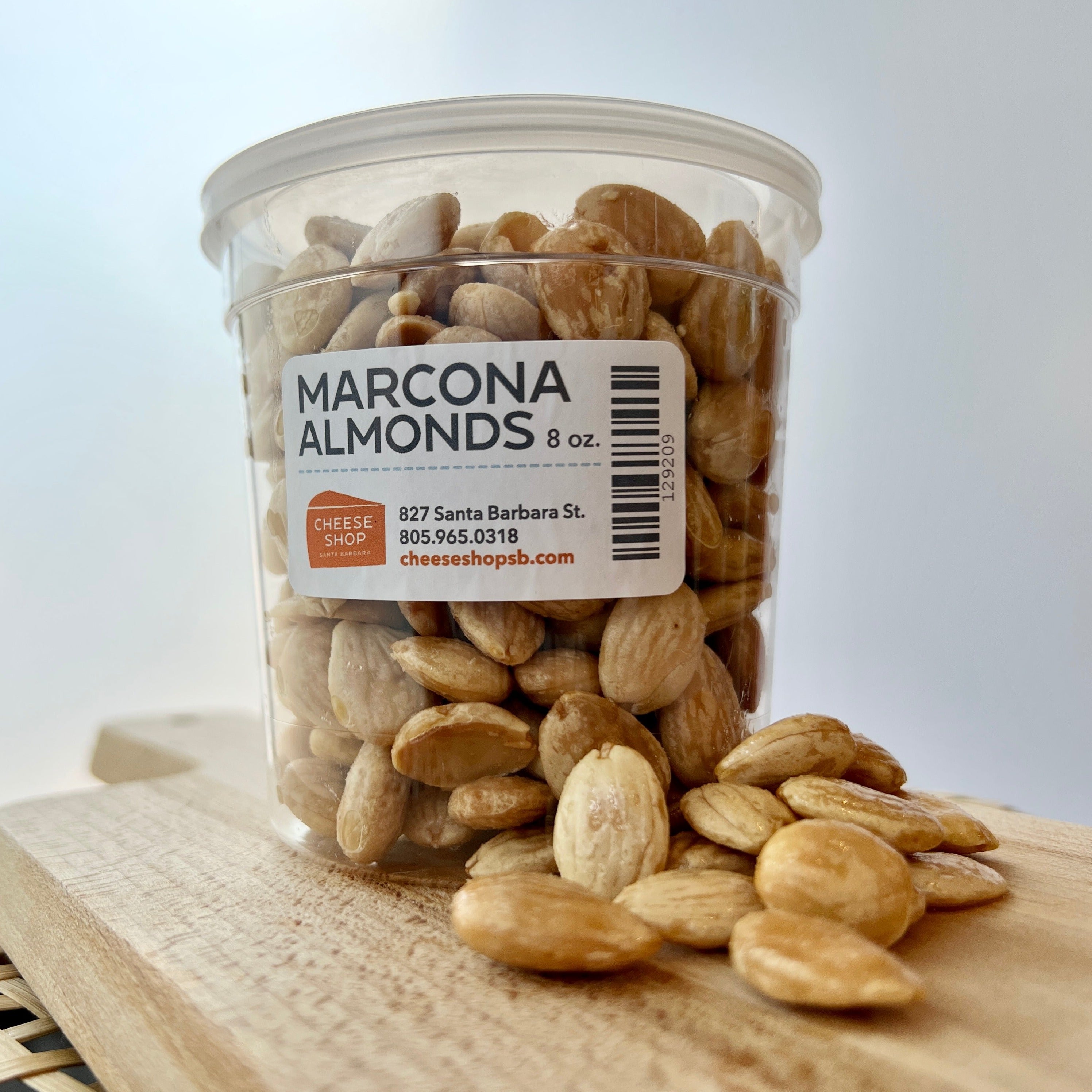 large plastic container of marcona almonds