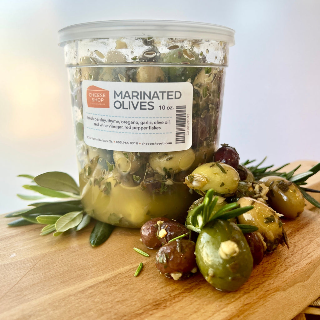 house marinated olives in plastic container