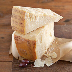 Two wedges of parmigiano-reggiano cheese