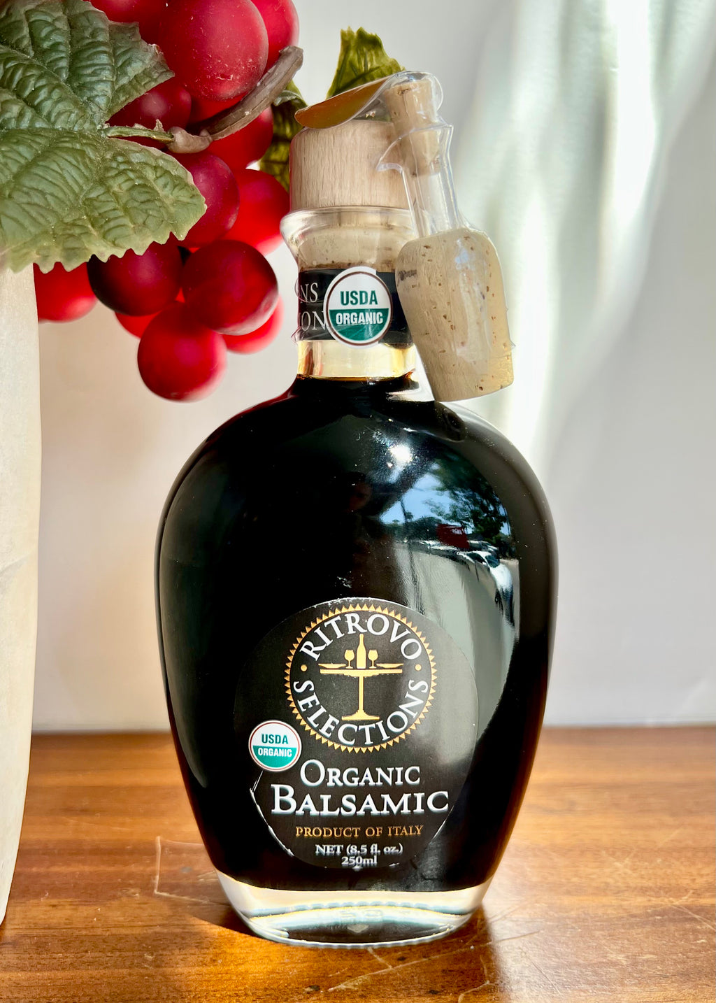 bottle of ritrovo balsamic vinegar with grapevine