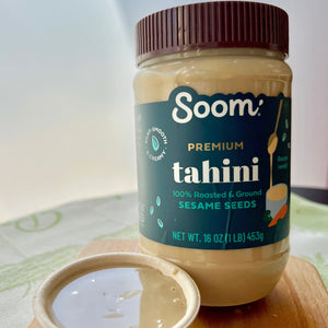 tahini in a cup with a jar